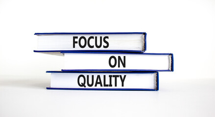 Focus on quality symbol. Concept words Focus on quality on books on beautiful white table white background. Business, focus on quality concept. Copy space.