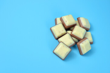 Bars of chocolate on a blue background.