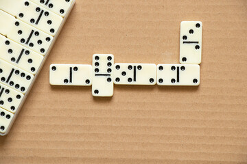 dominoes on brown paper close-up,domino effect