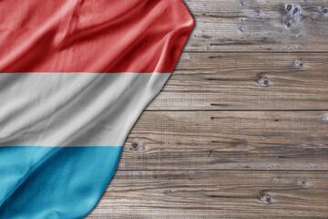 Wooden pattern old nature table board with Luxembourg flag