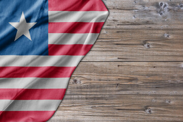 Obraz premium Wooden pattern old nature table board with Liberia flag