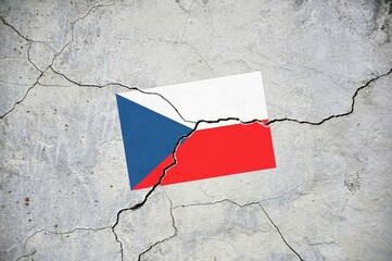 An old image of the flag of Czech Republic on a wall with a crack.