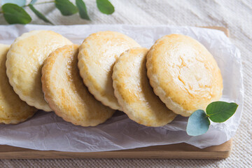 Homemade russian milk cookies korzhiki on white paper, selective focuc.