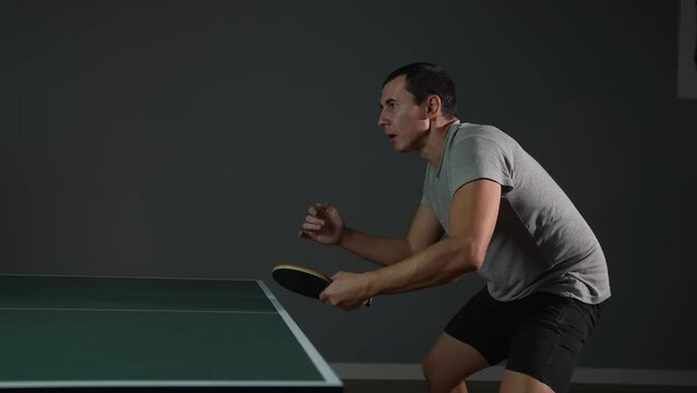 table tennis. man a athlete playing ping pong. sport party tournament concept. sportsman man training playing table tennis lifestyle. forehand and backhand exercise in ping pong