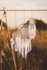 White cotton dreamcatcher at natural background, soft selective focus, toned - obrazy, fototapety, plakaty