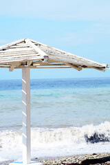 Wooden canopy on the beach for protection from the sun