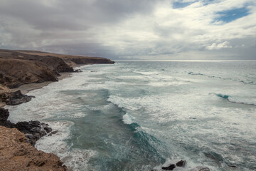 Fototapeta na wymiar La Pared beach seascape in a cloudy day. Fuerteventura. Canary Islands