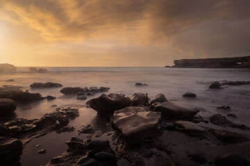 Naklejka premium La Pared beach long exposure seascape at sunset. Fuerteventura. Canary Islands