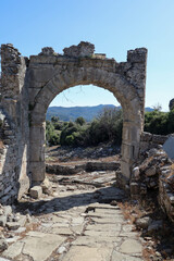 Fototapeta na wymiar The Ornamental Gate - ancient stone arch in Aspendos, Turkey