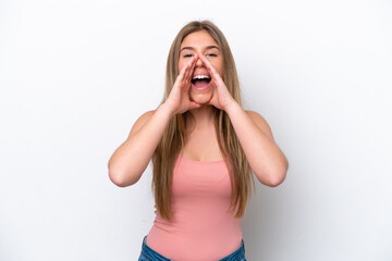 Young caucasian woman isolated on white bakcground shouting and announcing something