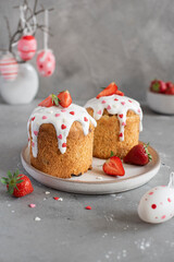 traditional Easter cake Kulich with sugar topping and strawberry