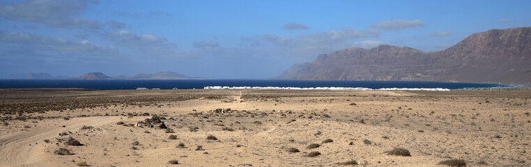  Caleta of Famara on the right and La Graciosa Island in the background on the left, Lanzarote, Spain