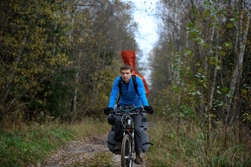 Naklejka premium Russian bicyclist in the autumn forest, Moscow Region