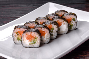 Traditional delicious fresh sushi roll set on a white background