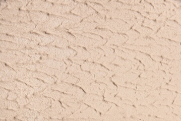 Old light color plaster wall with abstract pattern stucco surface texture background