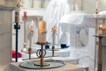 Fires buring on individual family candles on traditional Catholic ceremony for a wedding