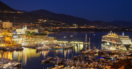 Aerial view of port Hercules in Monaco - Monte-Carlo at dusk, a lot of yachts and boats are moored...