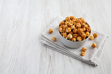 Homemade Caramel Popcorn in a gray Bowl, low angle view. Space for text.
