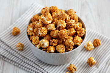 Homemade Caramel Popcorn in a gray Bowl, side view.