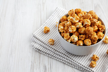 Homemade Caramel Popcorn in a gray Bowl, low angle view. Copy space.