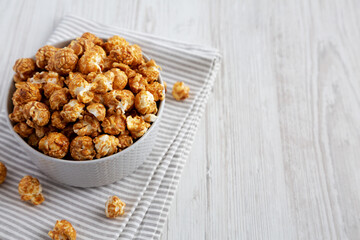 Homemade Caramel Popcorn in a gray Bowl, low angle view. Copy space.
