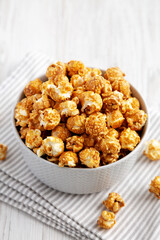 Homemade Caramel Popcorn in a gray Bowl, low angle view.