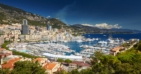 Fototapeta na wymiar Aerial view of port Hercules in Monaco - Monte-Carlo at sunny day, a lot of yachts and boats are moored in marina, mediterranean sea