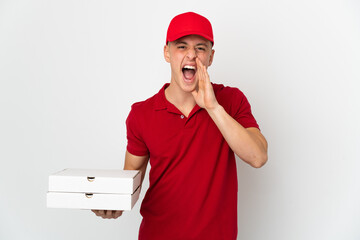 Pizza delivery man with work uniform picking up pizza boxes isolated on white background shouting...