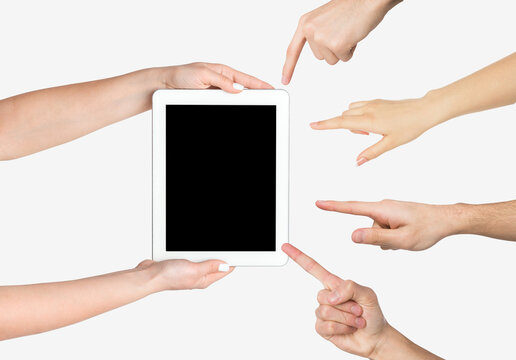 Female hands holding tablet, people pointing at screen