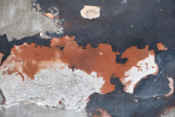 Old wall texture with cracked peeling paint. Abstract grunge backdrop