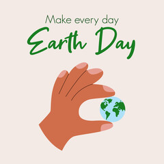 Earth day concept with hand holding planet