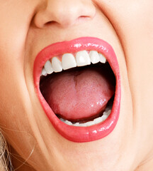 Open mouth of a woman, white healthy teeth