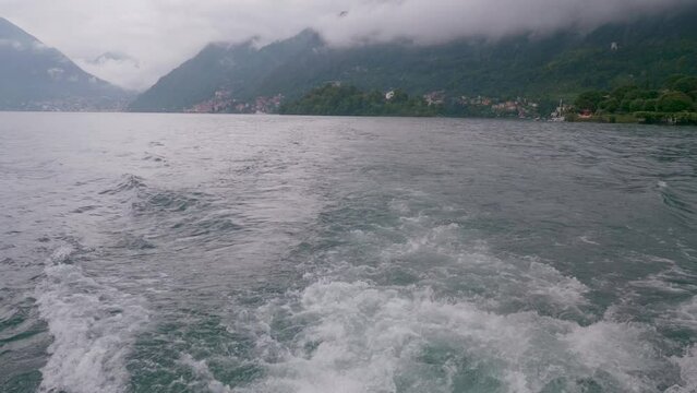 boat trip on lake como on a cloudy day