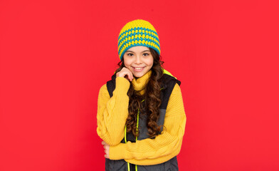 portrait of child wearing warm clothes. express positive emotion. winter fashion.