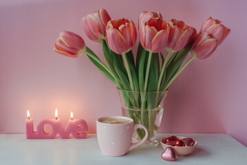 Fototapeta na wymiar Valentine day with cup of coffee, chocolate and candle
