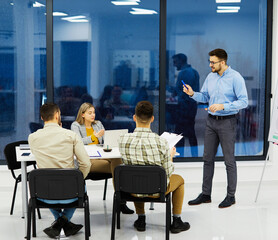 young business people meeting office teamwork group whiteboard presentation seminar man businessman startup project idea