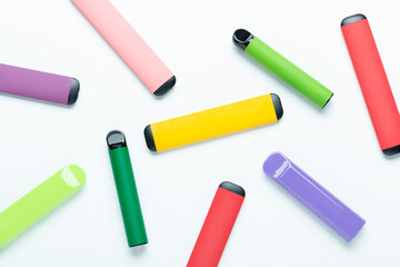 Electronic cigarettes on colored backgrounds
