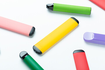 Electronic cigarettes on colored backgrounds