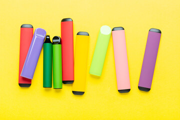 Electronic cigarettes on colored backgrounds