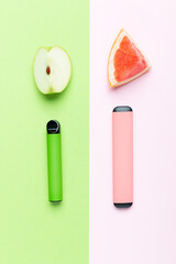 Electronic cigarettes with different fruit flavors with ingredients on colored backgrounds