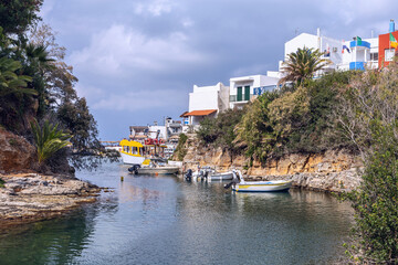 view of small boats in the harbor at the Greek fishing village of Sissi