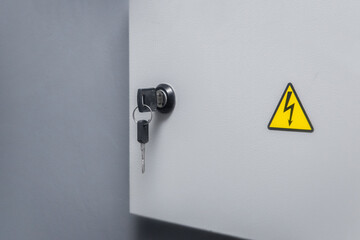 Key in the lock from the electrical power box, caution high voltage on the wall