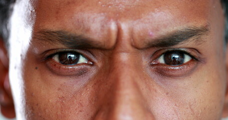 Suspicious Man has a serious look on his face. Closeup of man frowning and with an angry face