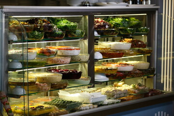 Vegan feed with different herbs and tomato salad.