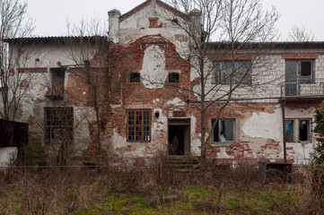 Fototapeta na wymiar Abandoned haunted distillery next to an old palace in Poland 