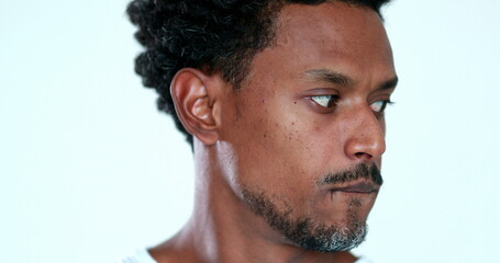Fototapeta na wymiar Portrait of anxious black guy looking to camera feeling restless and doubtful