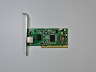 Ethernet network adapter computer card standing on a white background, high angle view