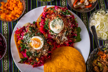 Enchilada Guatemalteca displayed with its ingredients 