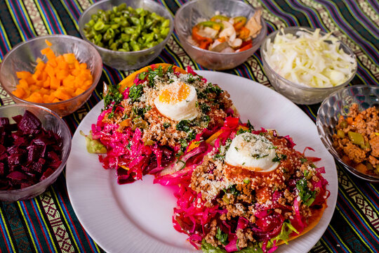 Enchilada Guatemalteca displayed with its ingredients 