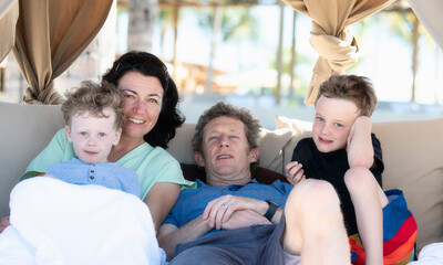Happy Family on Vacation Sitting in a Beach Cabana in Punta Mita, Nayarit, Mexico